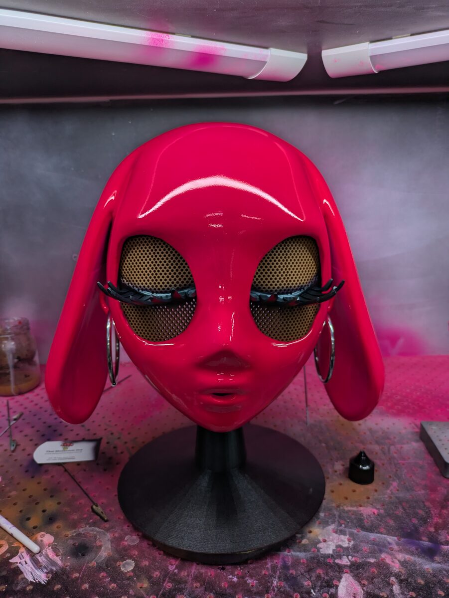 Red bunny mask on display stand